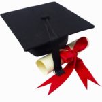 Close up of a graduation cap and a certificate with a ribbon --- Image by © Royalty-Free/Corbis